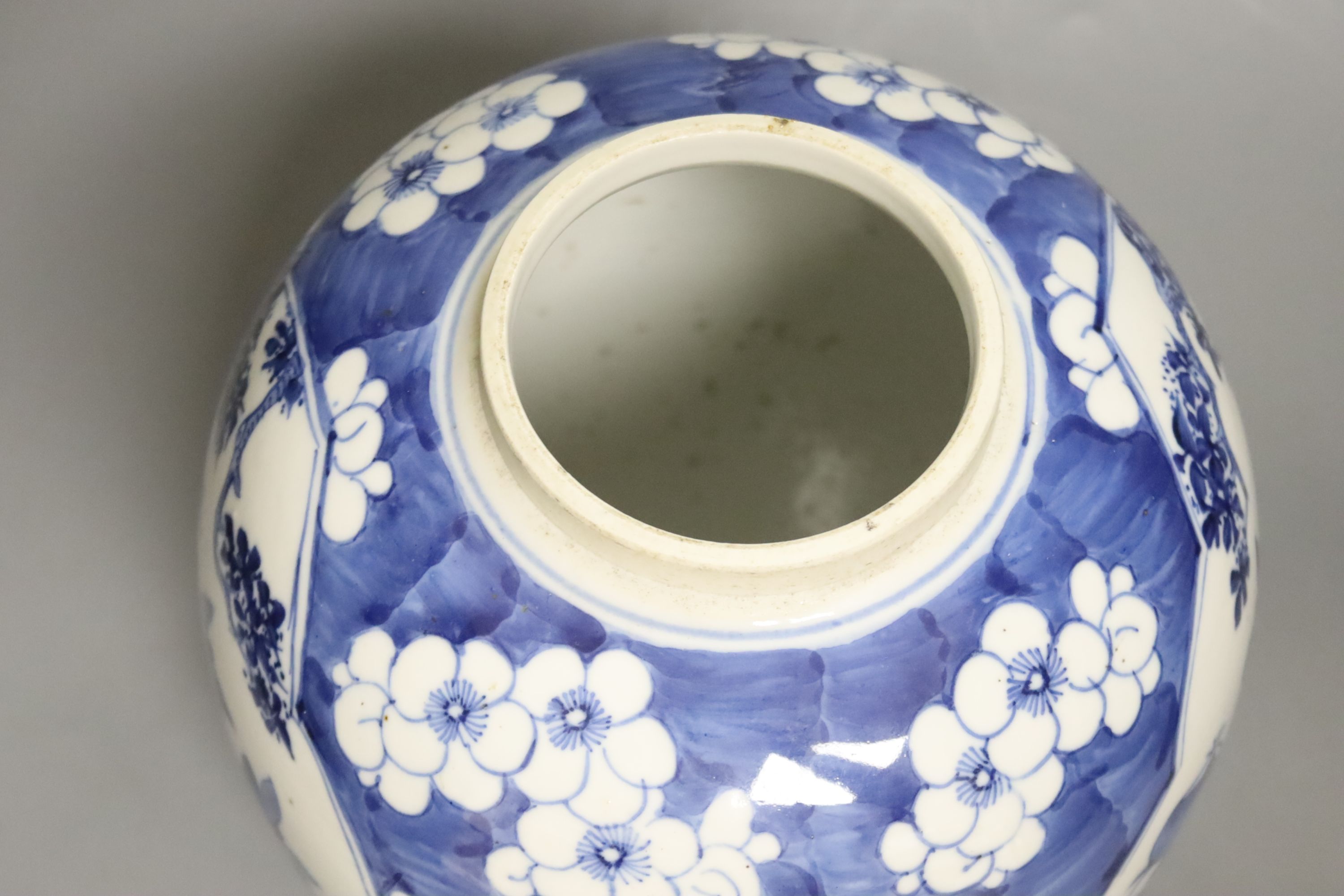 A late 19th / early 20th century Chinese blue and white jar, with wooden cover, height 25cm
